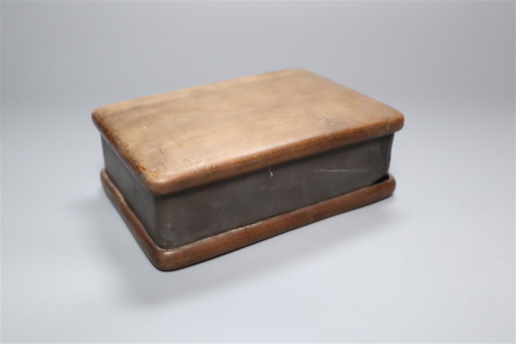 A 19th century Chinese black slate inkstone and another with wood base and cover
